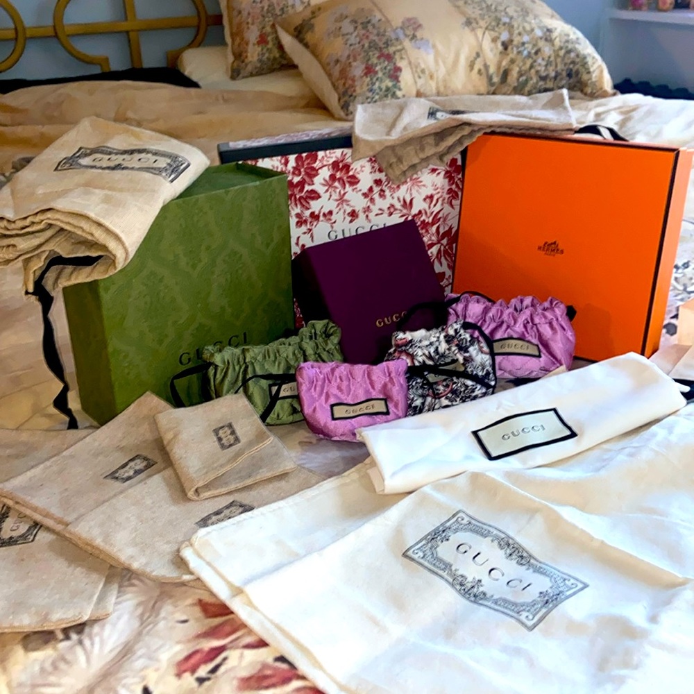Gucci gift boxes, bags, jewelry holders and one Hermes box. All together